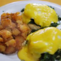 Eggs Florentine · This morning classic is two eggs poached, served over Spinach.