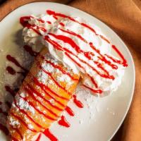 Deep-Fried Cheesecake · Cheesecake fried golden brown. Topped with strawberry syrup and whipped cream. Or choose you...