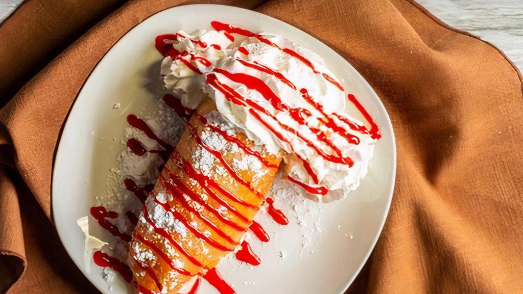 Deep-Fried Cheesecake · Cheesecake fried golden brown. Topped with strawberry syrup and whipped cream. Or choose your favorite toppings.