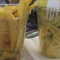 Mango Biche · FRESH MANGO PIECES SEASONED. TOPPINGS: LEMON, SALT, VINEGAR, LEMON PEPPER, BLACK PEPPER, CHA...