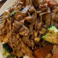 Pad See Ew · Another popular noodle dish, stir fried wide rice noodles with egg, broccoli, and carrot.