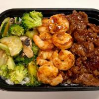 Beef And Shrimp Cajun Plate · beef and shrimp with mixed vegetables (zucchini, broccoli, and mushroom) and sauce (cajun or...