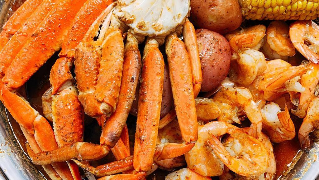 Snow Crab Legs And Shrimp No Head · (1 cluster) Snow Crab Legs + (0.5 lb) Shrimp No Head
(Every bag includes corn and potato)