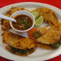 53) Quesabirria · 4 Tortillas dipped in Birria (Beef Stew) soup then lightly fried, filled with melted mozarel...