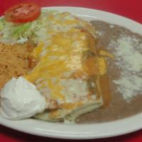 21) Burrito Plato · A 12 inch flour tortilla with your choice of meat, cilantro, onions, rice and beans. Topped ...
