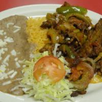 7) Steak Ranchero · Strips of steak with sliced tomato, bell peppers and onions in a spicy red sauce. Comes with...