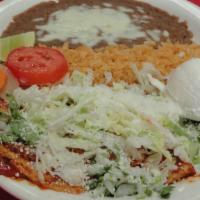 11) Enchiladas Rancheras (3) · 3 Enchiladas corn tortillas dipped in red sauce. Your choice of meat inside. Topped with cil...