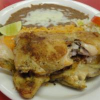 6) Pollo Asado · Half a chicken. Comes with rice, beans, lettuce, tomato and your choice of flour or corn tor...