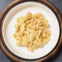 Fettuccine Work Of Art · Fresh fettuccine cooked with your choice of sauce, veggies, and meats and topped with black ...