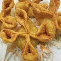 Crab Rangoon (6 Pcs) 蟹角 · Deep fried wonton skin stuffed with cream cheese.