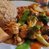 Hunan Chicken · White meat chicken sauteed w/assorted vegetable in a brown spicy sauce.