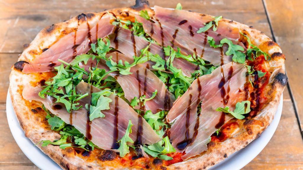 Prosciutto · Tomate sauce, mozzarella cheese, arugula, prosciutto and glaze balsamic