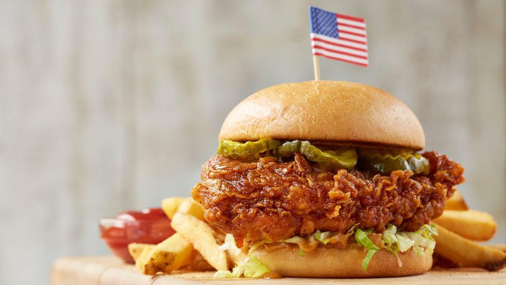 Spicy Chicken Sandwich · Fresh, hand-breaded chicken breast tossed with spicy Chicken sauce with lettuce ,tomatoes, pickles and spicy mayo on a toasted bun. Served with French fries.