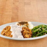 Country Fried Steak · Tender steak breaded in our signature seasoned flour, cooked to a golden brown, and topped w...