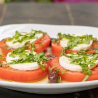 Caprese Salad (Large) · Fresh mozzarella, sliced tomatoes, and fresh basil, topped with extra virgin olive oil.