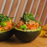 Avokai Salmon · Scallions, mango, cilantro, seaweed salad, passion fruit sauce.