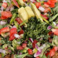 Colombiano · Lentils over wild rice, with organic greens, red onion, tomato, avocado and cilantro tossed ...