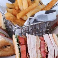 Club House Sandwich · The double decker sandwich is delicious blend of turkey, ham, bacon, lettuce, and tomato wit...