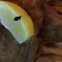 Corona Beer Battered Fish & Chips · Tilapia fillet dipped in our special corona beer batter and deep fried until golden brown. S...