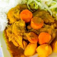 Curry Chicken · Comes with rice and peas cabbages and plantains.