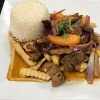 Lomo Saltado · Sauteed beef mixed with onions and tomatoes