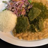 Seco De Res · Beef Stew made with Cilantro sauce served with rice and white beans