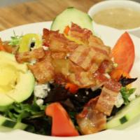 Cobb Salad · Mixed greens, peppers, onions, cucumbers, tomatoes, olives, bacon, and bleu cheese.