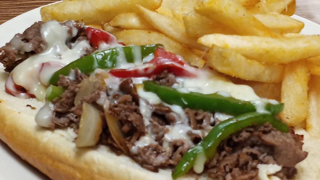 Philly Cheese Steak · Fresh & thinly shaved steak grilled with peppers, onions, and mozzarella cheese served on a hoagie roll with a side of fries.