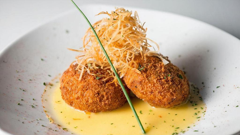 Crab Cakes · Jumbo lump crab breaded and flash fried. Served over a bed of Beurre Fondue sauce and topped with our finely cut potato 