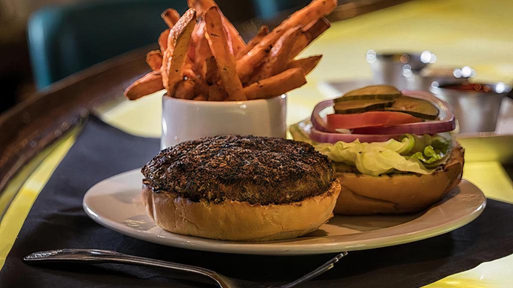 Butcher'S Blend Burger · Blend of Brisket, Chuck & Short Rib burger topped with lettuce, tomato, onions, and pickles served with French fries and choice of cheese.