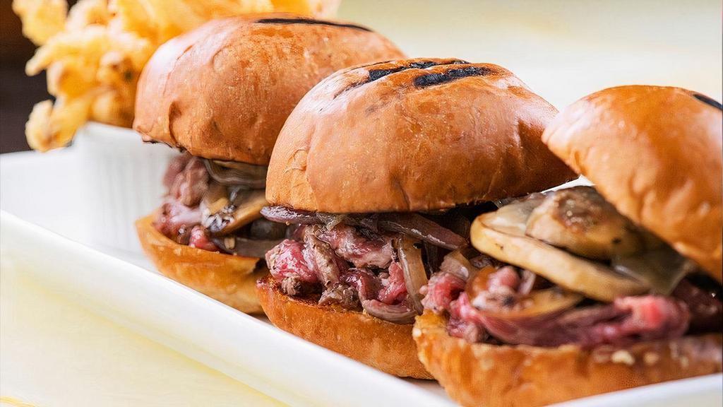 Filet Sliders 79 · Beef tenderloin with sautéed mushrooms and red onions & topped with Swiss cheese. Served on three silver dollar buns, and accompanied with onion strings.