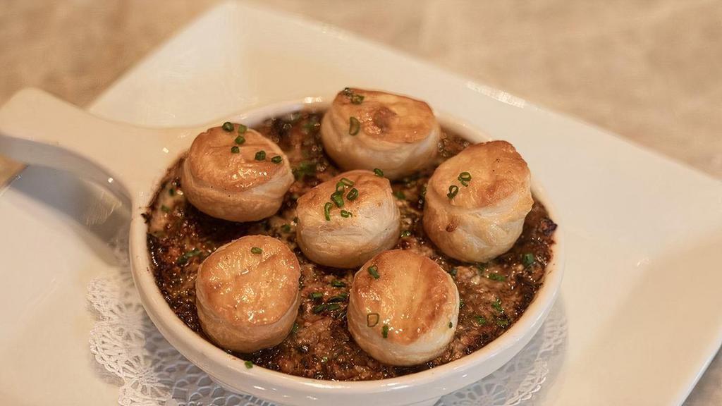 Escargot | Gfm · Six oven baked snails topped with onion-garlic stuffing, herb-garlic butter and puffed pastries