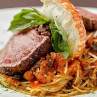 Surf & Turf Pasta* · Six ounces of beef tenderloin tips and 2 ounce of lobster tail. Served over a bed of angel h...