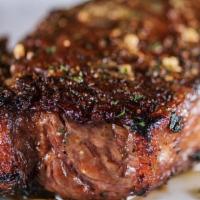 Prime New York Strip, 14 Oz* | Gf · 14 ounces. Seasoned with Perry's Signature Steak Seasoning, char-broiled and topped with cho...