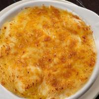 Au Gratin Potatoes · Baked potatoes skinned and diced, mixed with white cheddar, smoked gouda, oven baked and top...