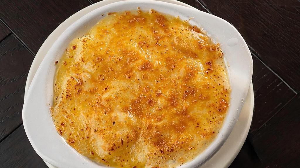 Au Gratin Potatoes · Baked potatoes skinned and diced, mixed with white cheddar, smoked gouda, oven baked and topped with parmesan cheese and chives. | VE