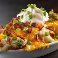 Loaded Whipped Potatoes | Gf · Whipped Potatoes loaded with cheddar cheese, butter, bacon and chives