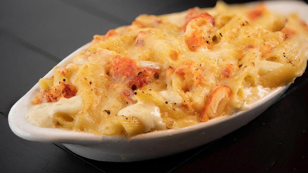 Lobster Mac & Cheese · Lobster meat sautéed in Alfredo sauce with Penne pasta. Topped with Monterey Jack cheese and oven baked | VE