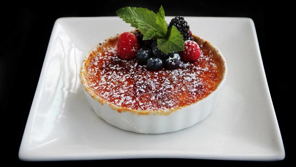 Creme Brulee · Vanilla bean custard topped sugar and caramelized, served with a fresh assortment of berries.