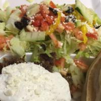 Gyro Plate · Lamb meat, Greek salad, fries, pita bread and drink.