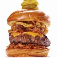 The Kansas City Burger · Hou faves. Brown sugar bacon, bbq carnitas, onion straws, cheddar, bbq sauce. 1255 cal.