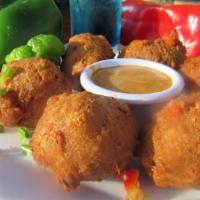 Jamaican Fritters · Savory and spicy codfish, battered and fried to perfection.