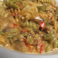 Jerk Chicken & Shrimp Pasta · Tri-color fusilli, peppers, onions, mozzarella cheese, Caribbean herbs and spices and served...
