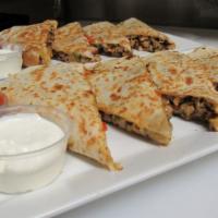 Jerk Chicken Quesadilla · Flour tortillas filled with chicken, mixed cheeses, peppers, onions, grilled to perfection a...