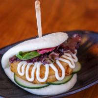 Jinya Bun · Steamed bun stuffed with slow braised pork chashu, cucumber and baby mixed greens served wit...