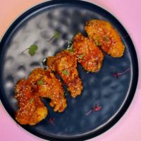 Wings Baby Wings · Fried chicken wings with kimchi butter.
