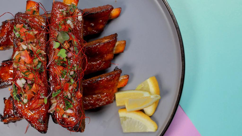 House Ribs · Half rack with our spicy sauce (pineapple chipotle) or sweet (Japanese BBQ).