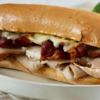 Bistro Club · Smoked turkey breast, bacon, cheese, mayo, toasted hoagie roll. Includes side salad.