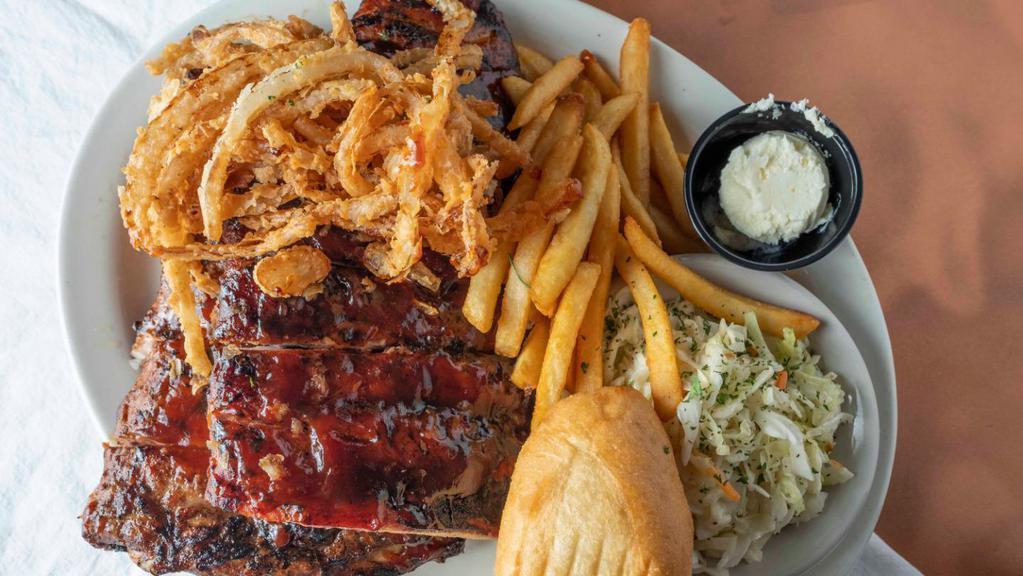 Half Rack Fire Braised Bbq Ribs · A meaty, half rack of smoked and slow cooked, until they fall off the bone ribs, seasoned and basted in BBQ sauce. Our finger licking good ribs are topped with our own onion straws to seal the deal.