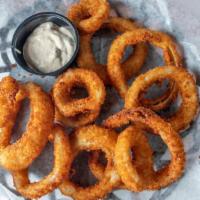 Onion Rings · Hand cut and breaded, deep fried to a golden brown.  Served with a side of horseradish sauce.